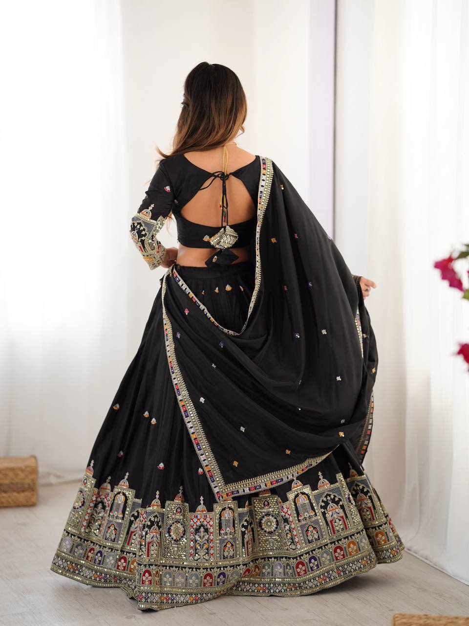Majestic Midnight Black Designer Lehenga Choli Featuring Intricate Multicolored Architectural Embroidery and Mirror Work